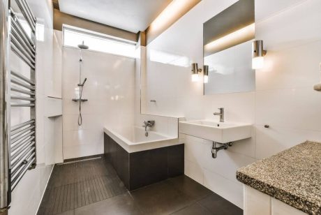 white bathroom with bathtub and sink - Big Easy Renovation